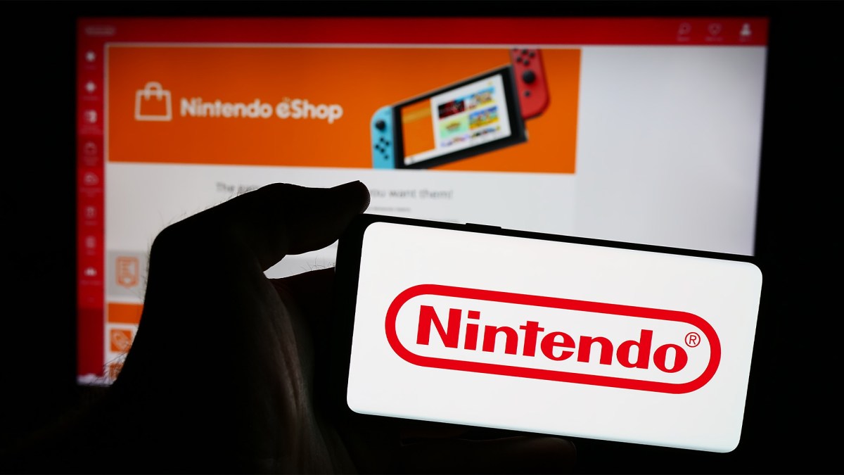 Smartphone mit dem Nintendo-Logo vor einem Bildschirm, auf dem der Nintendo eShop geöffnet ist.